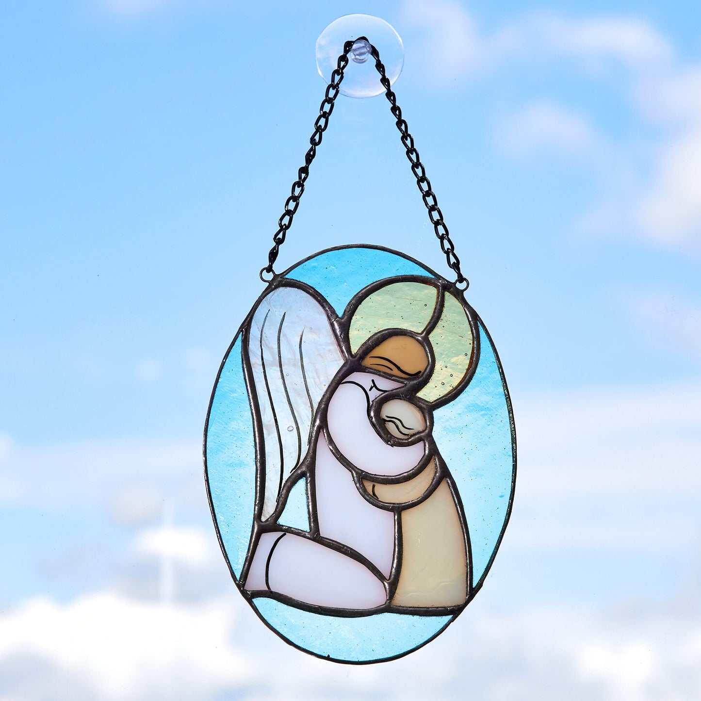 Hugging angel stained glass ornament